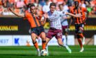 Police are hunting a fan who threw a lighter from the George Fox stand on Sunday. Image: Malcolm Mackenzie/Hearts FC/ProSports/Shutterstock