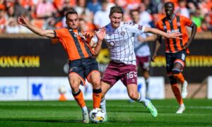 Police are hunting a fan who threw a lighter from the George Fox stand on Sunday. Image: Malcolm Mackenzie/Hearts FC/ProSports/Shutterstock