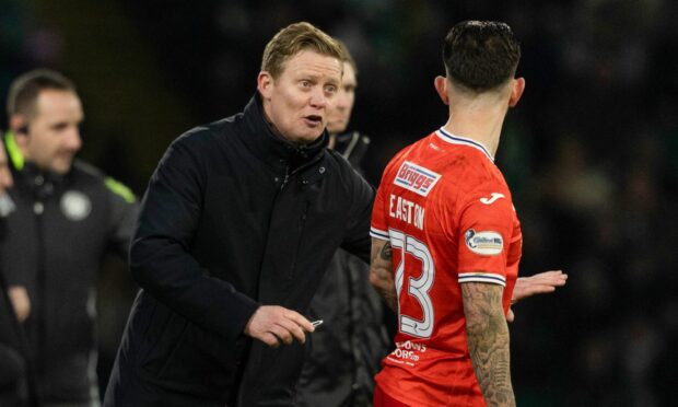 Raith Rovers boss Barry Robson gives Dylan Easton instructions during a game.