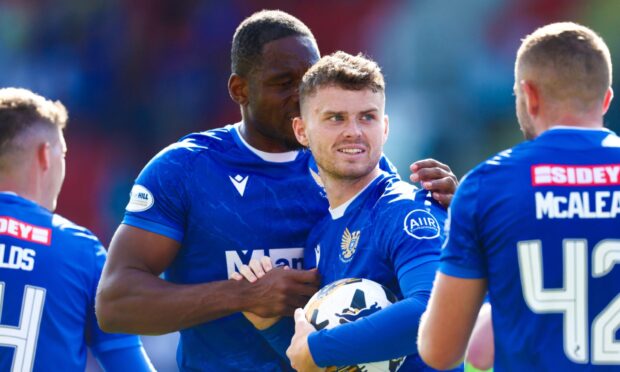 Josh McPake clutching the match ball after the game.