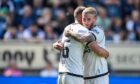 Dundee United midfielder Craig Sibbald congratulates team-mate Max Watters.