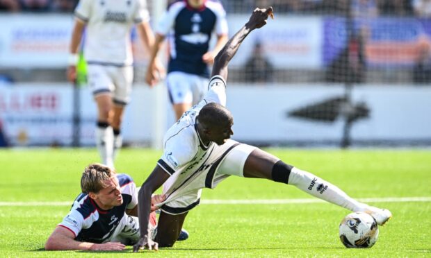 Panutche Camara somehow retains possession - a theme of Sunday