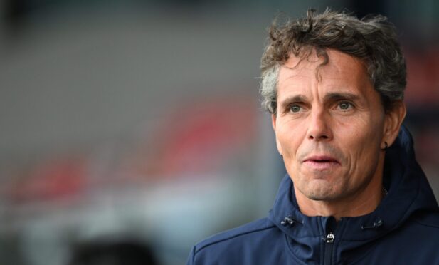 Simo Vlakari watches from the touchline at Ross County.