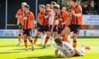 Stuart Findlay contorts to head home