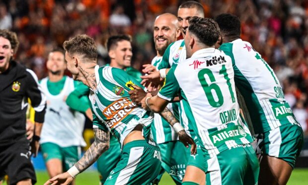 Rapid celebrate their triumph.