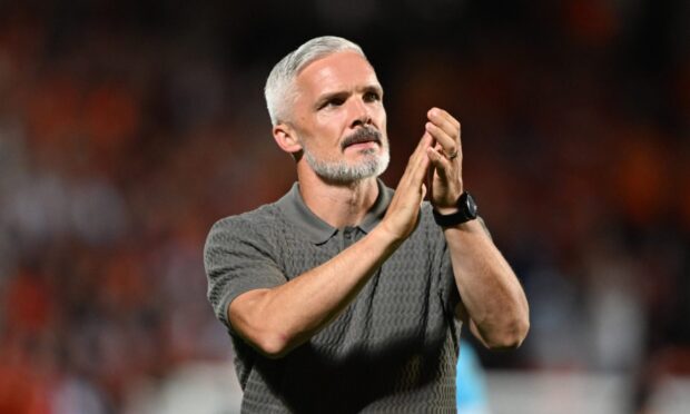 Jim Goodwin applauds the Dundee United faithful
