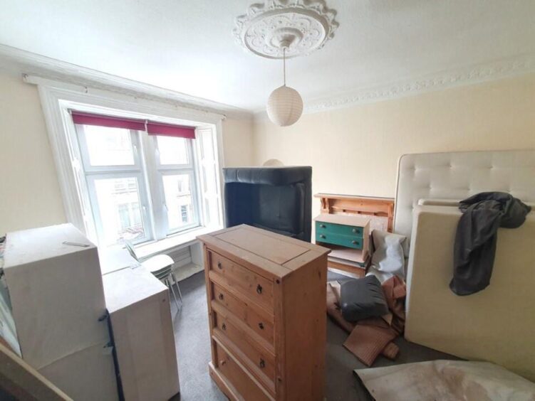 A view of one of the bedrooms with furniture inside.
