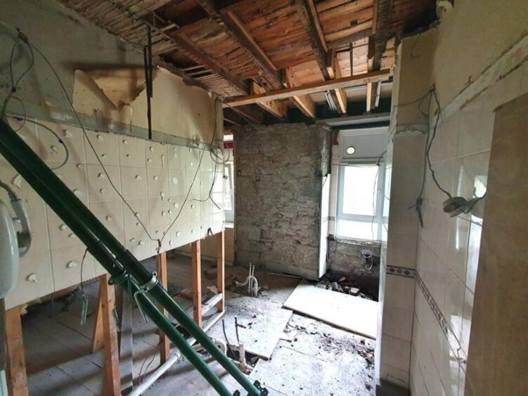 Parts of the flat have been significantly stripped back.