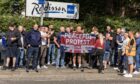 Anti-immigration protesters demonstrate outside the Radisson Blu Hotel on Leonard Street in Perth