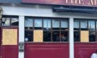 Windows at The Admiral Bar have been boarded up. Image: Supplied