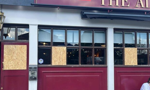 Windows at The Admiral Bar have been boarded up. Image: Supplied