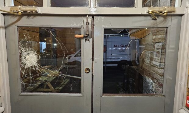 Smashed windows at the Admiral pub.