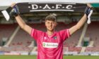 New Dunfermline Athletic signing Billy Terrell holds up a DAFC scarf.