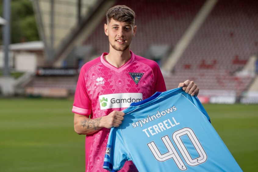 New Pars keeper Billy Terrell holds up a strip with his name and number on the back of it.