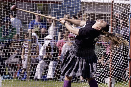 Heavyweight competitor Stacey Wilson gives her all at Bridge of Allan Highland Games 2025. Image: Phil Hannah