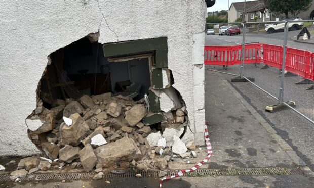 Damage to the house in Cairneyhill after a van crashed into the building.