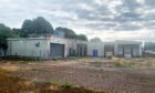 Derelict former ABP abattoir in Perth showing boarded up buildings and weeds