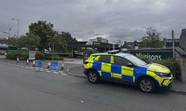 Police at the Morrisons petrol station in Perth. Image: Lucy Scarlett/DC Thomson