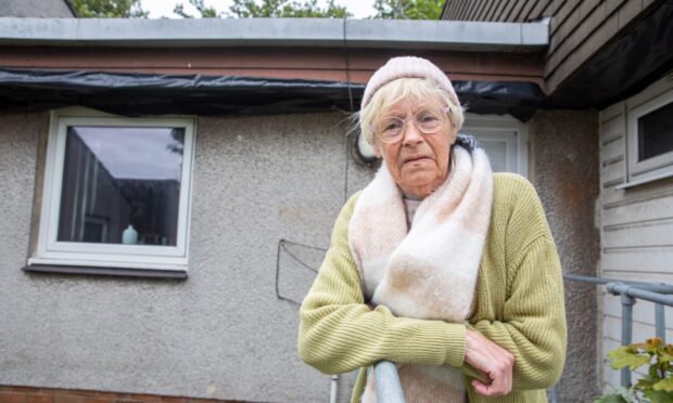 Catherine Maxwell outside her Methil home which has been left with holes in the walls