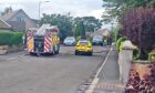 Emergency services are at the scene on Kinnordy Road. Image: Lindsey Hamilton