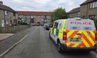 Police on Allan Park in Hill of Beath after the raid. Image: Andrew Robson/DC Thomson