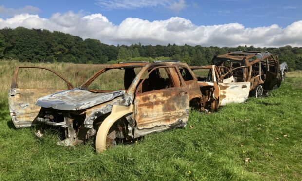 Burnt-out car on Dundee's Camperdown Park