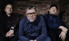 the three members of Doves sit down to pose for a press shot