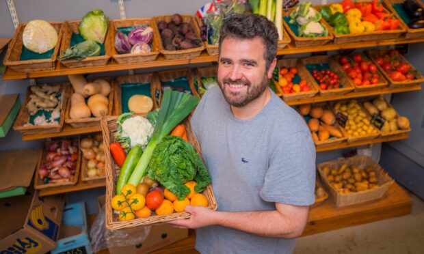 Fraser Reid runs Fraser's Fruit and Veg shop in Dundee. Image: Steve MacDougall/DC Thomson