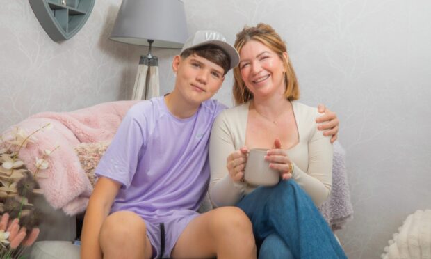 Dundee mum Kim is living with secondary breast cancer. She is pictured with her son Bobby.
