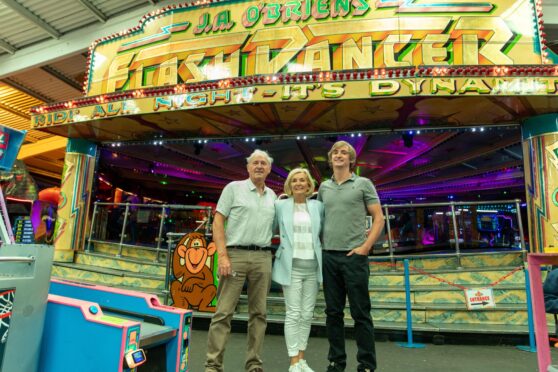 Ellen and Jimmy O'Brien with son, Todd  in front of the original 1960s Pleasureland waltzer. Image: Steve Brown/DC Thomson