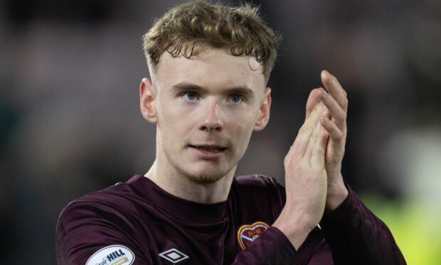 Adam Forrester applauds the Hearts fans.