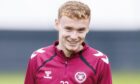 Adam Forrester smiles during a Hearts training session.