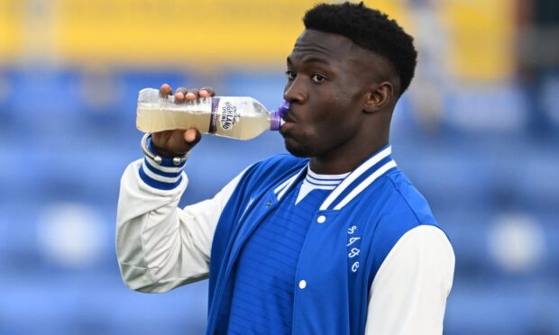 Adama Sidibeh takes a drink before St Johnstone played Ross County.