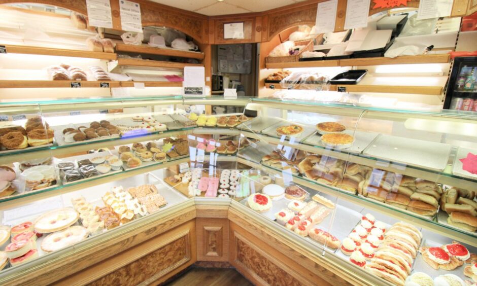 Various cakes and treats on display.