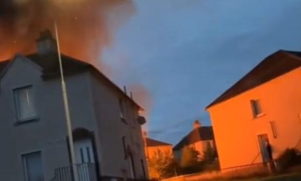 an image showing the orange glow behind a Kirkcaldy home