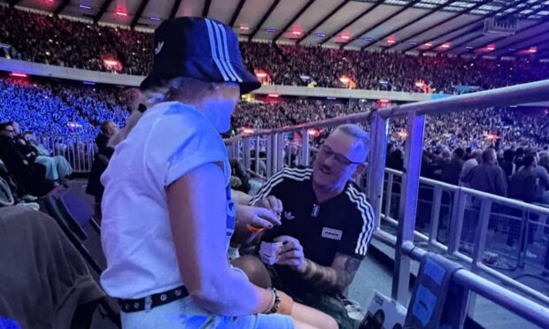 Dwayne Yuill pops the question to Shell Hodge during the Oasis gig at Murrayfield. Image: Shell Hodge