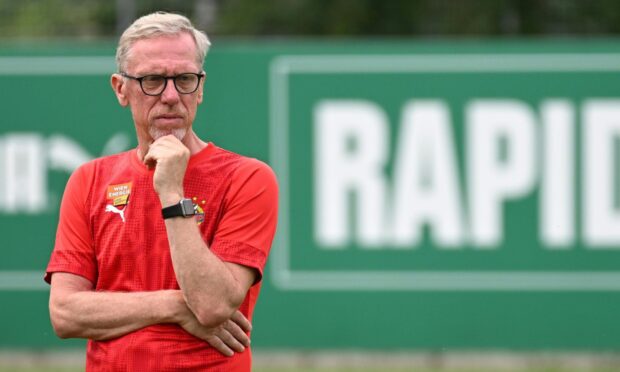 Peter Stoger looks on at Rapid training