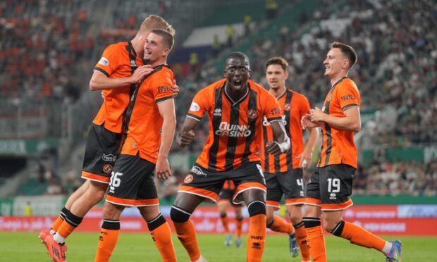 Dundee United players celebrate in Vienna.