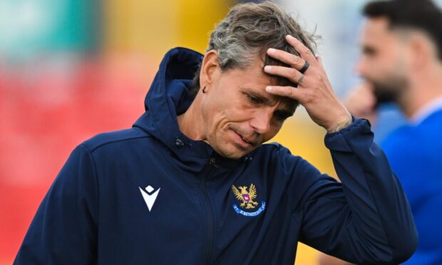 Simo Valakari with his hand to his head.