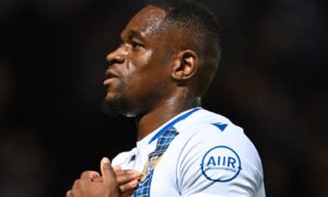 Uche Ikpeazu taps the St Johnstone badge after the game against Ross County.