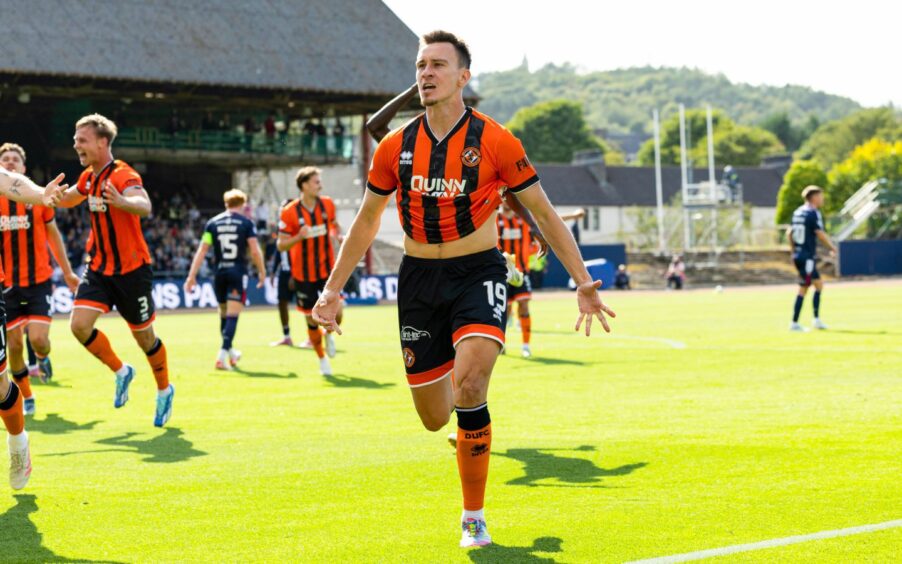 Ivan Dolcek celebrates scoring United's second goal against Dundee.