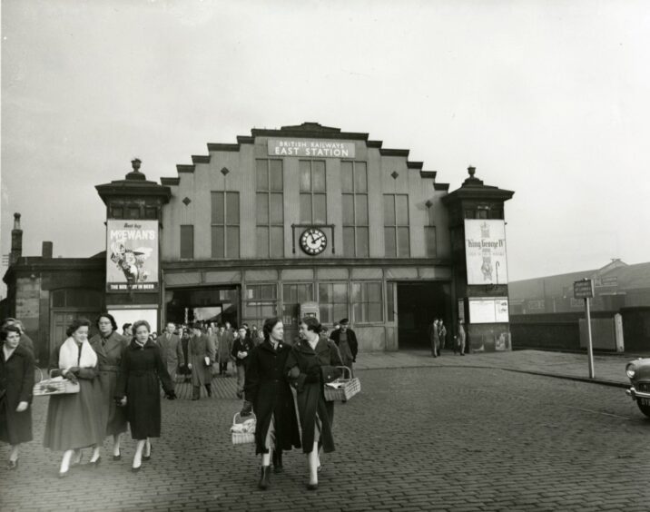 people walking outside a 1950s railway station in Dundee.