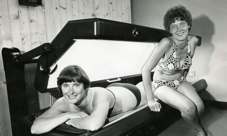 Ardler Community Centre opened a solarium in June 1981. Pictured enjoying it are playgroup supervisor Val Melvin and office receptionist Gladys Linton. Image: DC Thomson.