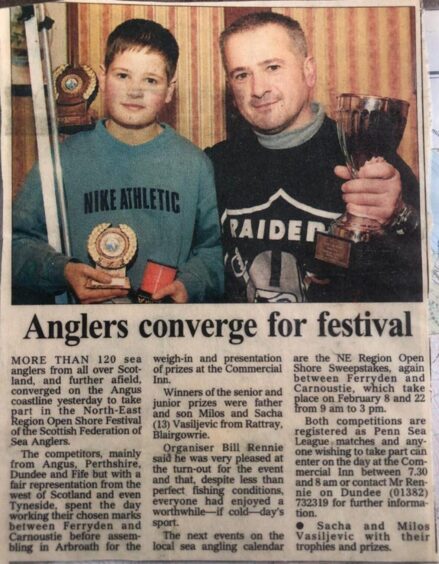 newspaper clipping with photo of Milos Vasiljevic and son, then aged 13, after winning a fishing competition