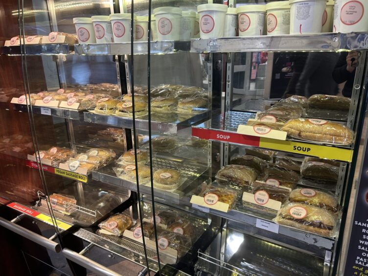 An array of hot food items for sale in Segafredo Caffe.