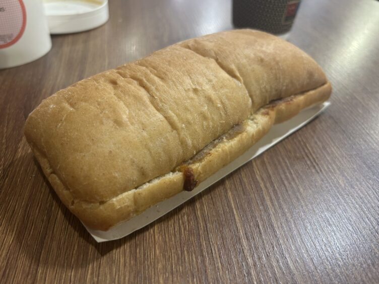 The tuna melt, sitting on a table.