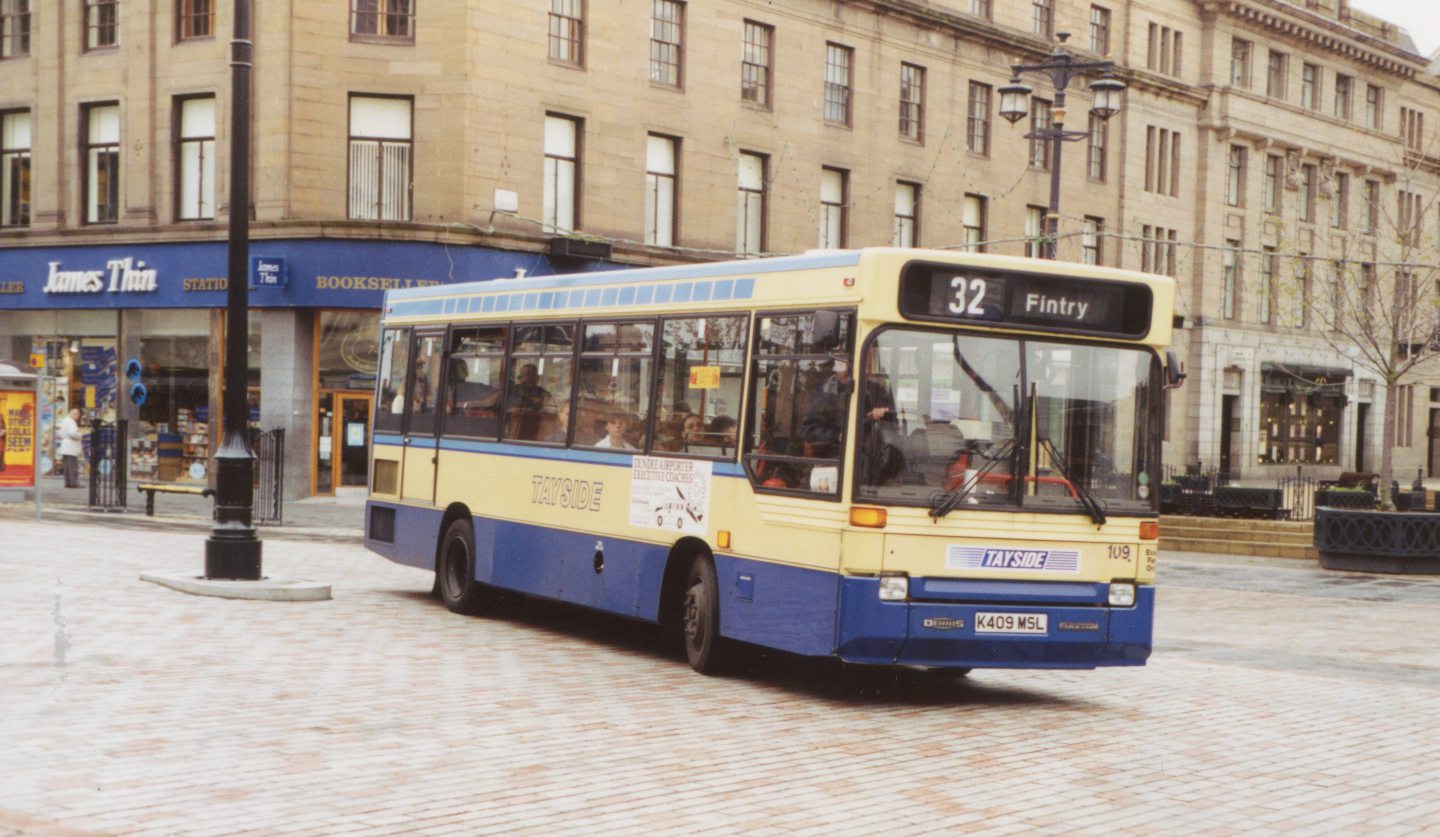 A Fintry bus turns past City Square in Dundee.