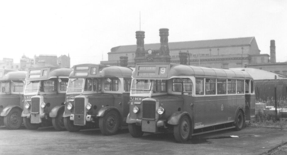 Buses line up in Dundee with the Royal Arch in the background in the late-1950s.