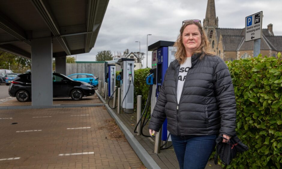 Nora McElhone standing by EV charging units at car park in Broughty Ferry where she has been looking for vape litter.