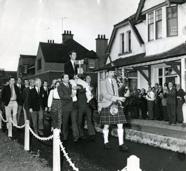 Golfer Ian Hutcheon being carried to the clubhouse in Monifieth in 1973. 